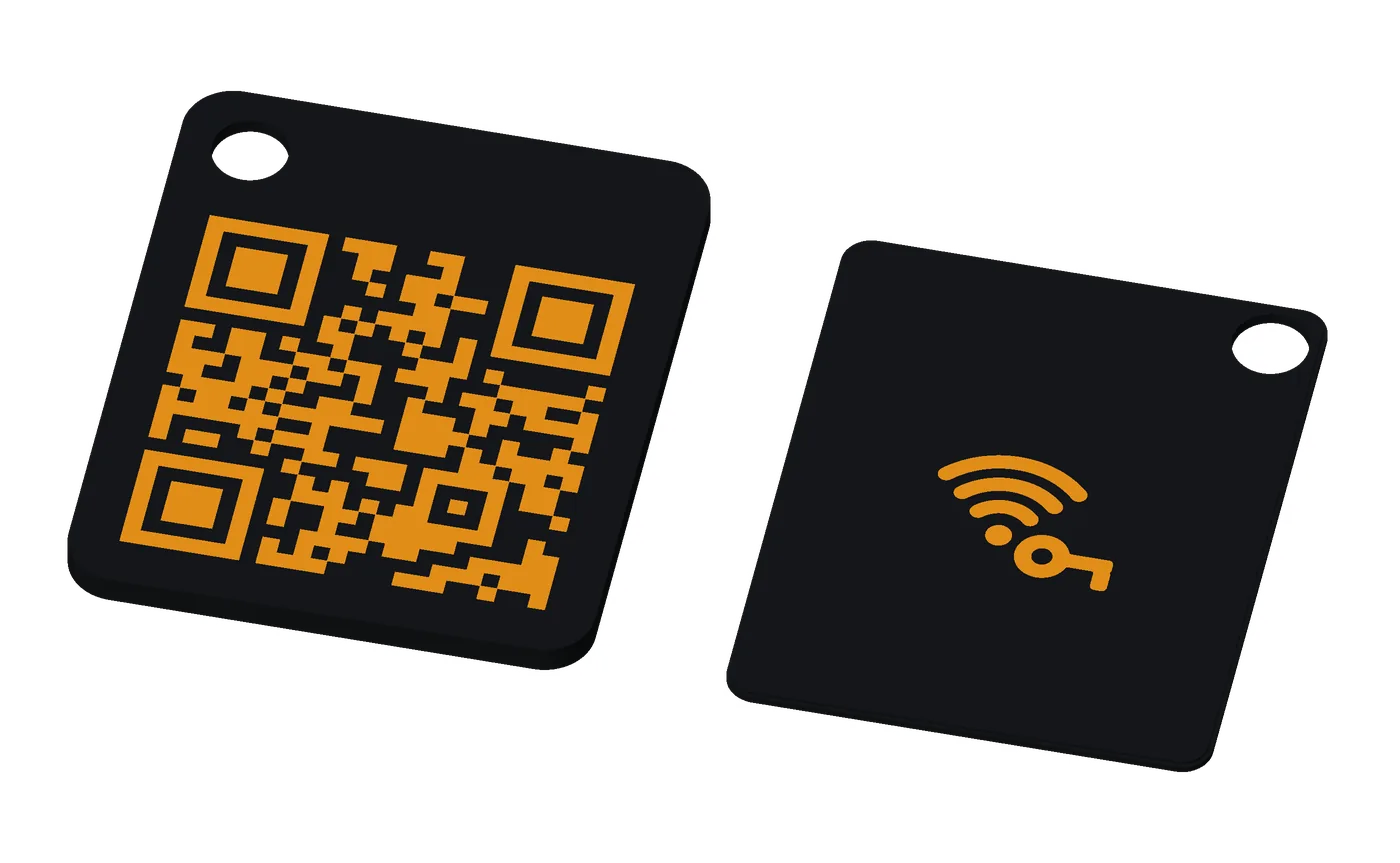 A base tag, orange on black: both pieces, the front and the back.
