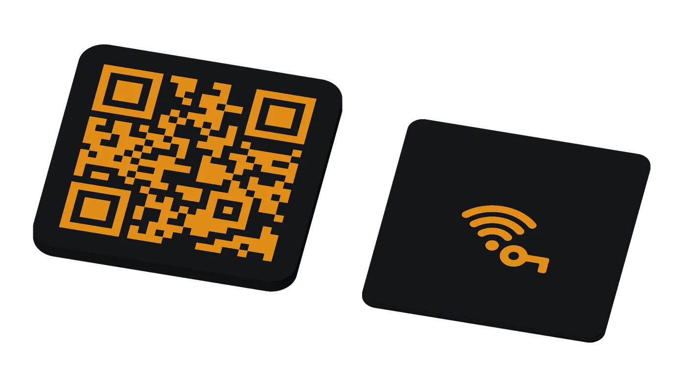 An earless Base tag, orange on black: no ring hole, for a stand or a home project.