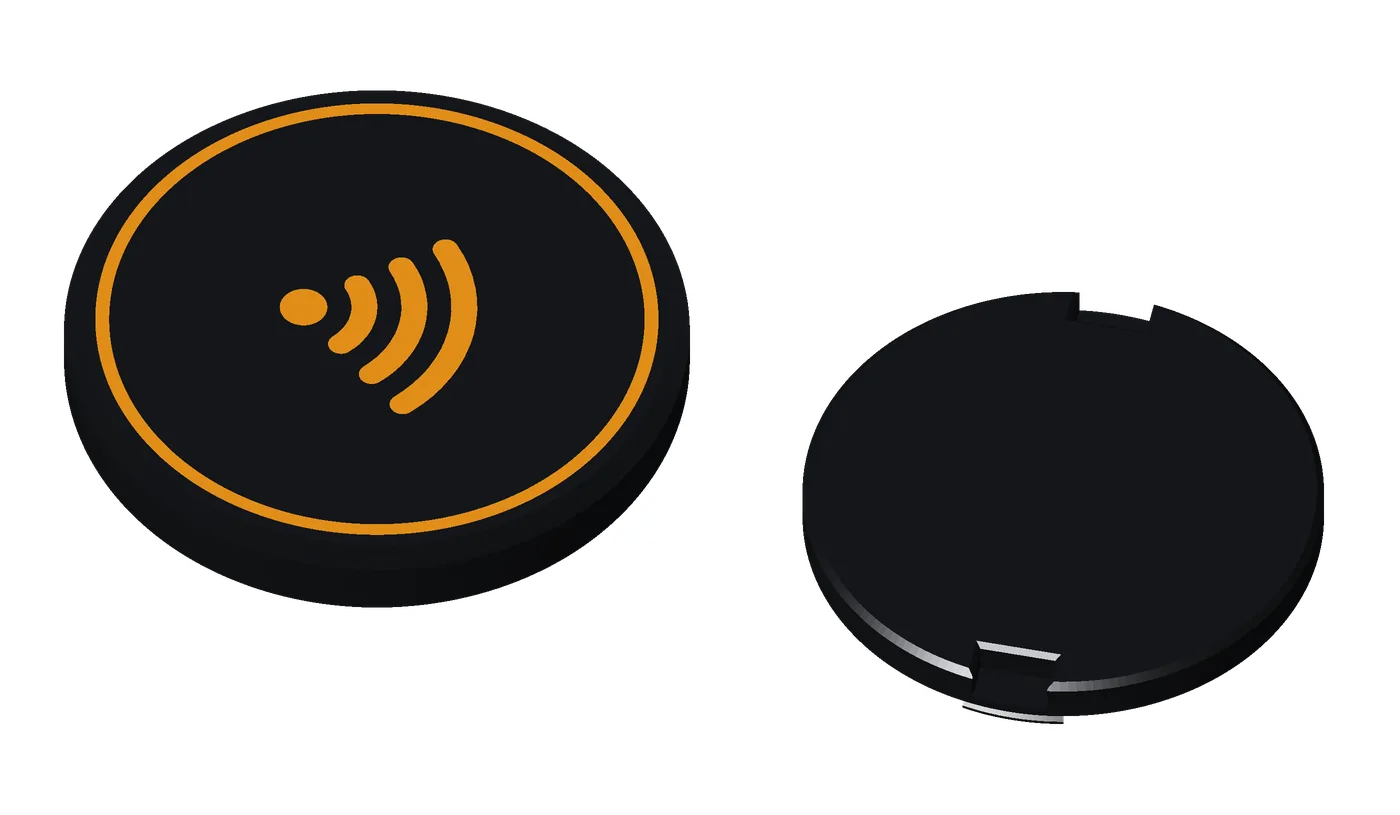 An earless Premium coin, orange on black: no ring hole, for a stand or a home project.