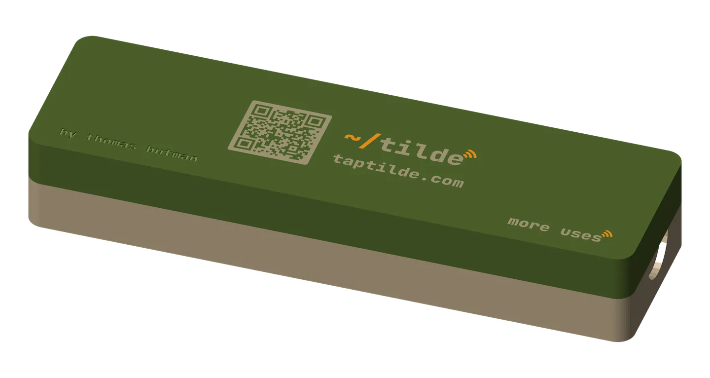 The giveaway box closed: a long khaki base under an olive lid with a khaki QR code, the ~/tilde wordmark with an orange ~/ and tap waves, and taptilde.com.