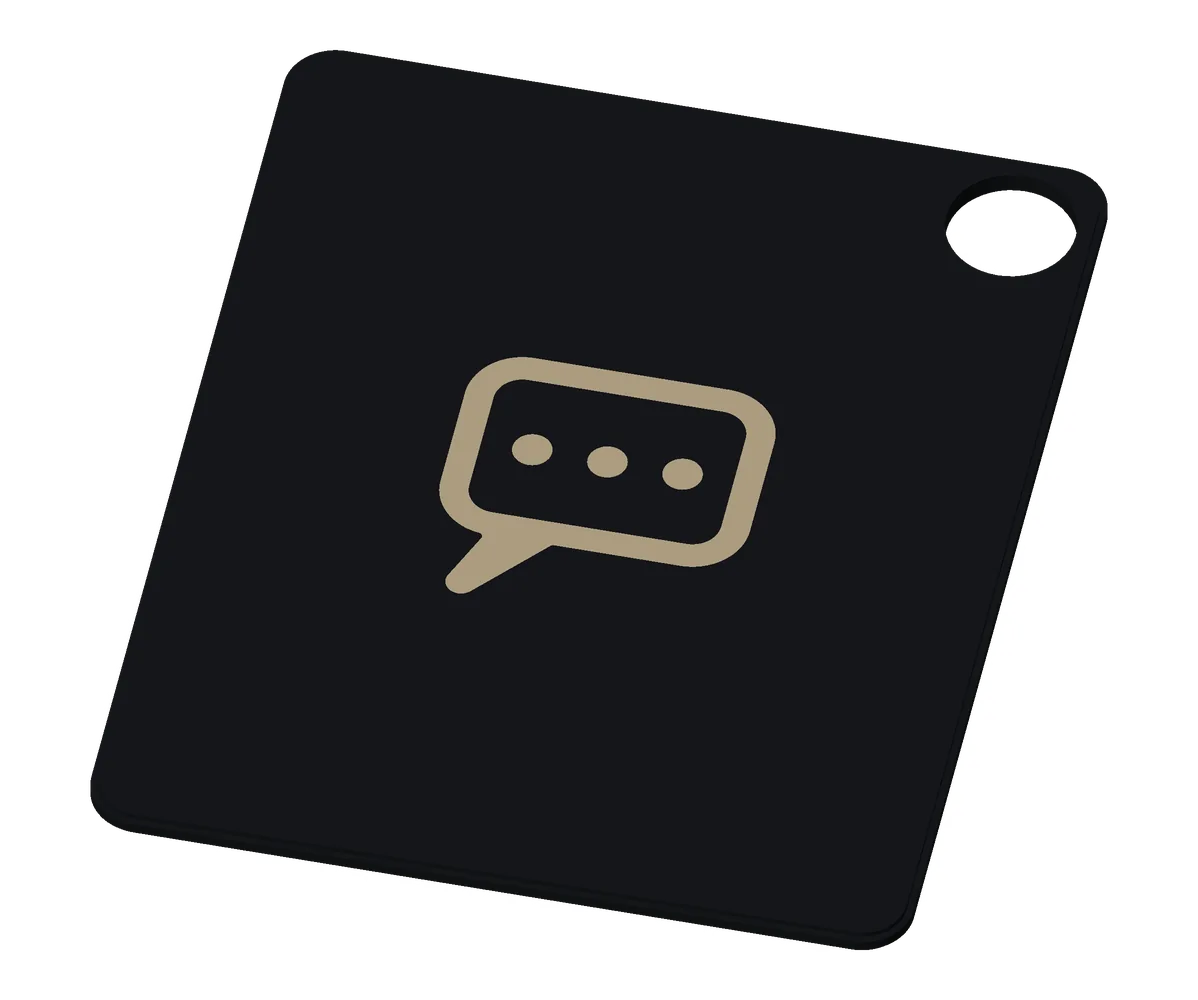 The WhatsApp (a generic chat icon) tag from the giveaway box, khaki on black.
